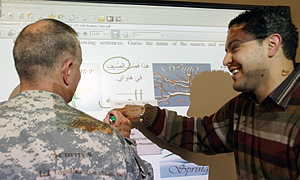 With instructor in front of a SmartBoard